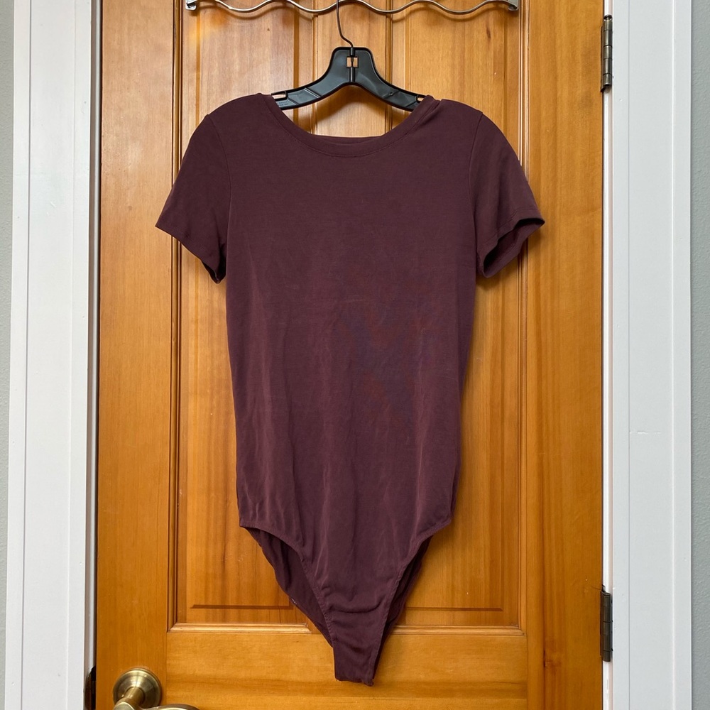 Me to We wine colored body suit